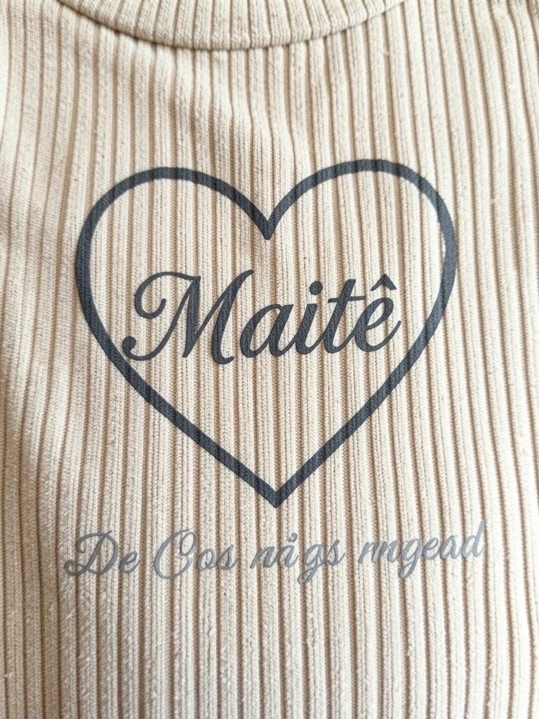 Coração com a palavra Maitê escrita em letras cursivas.